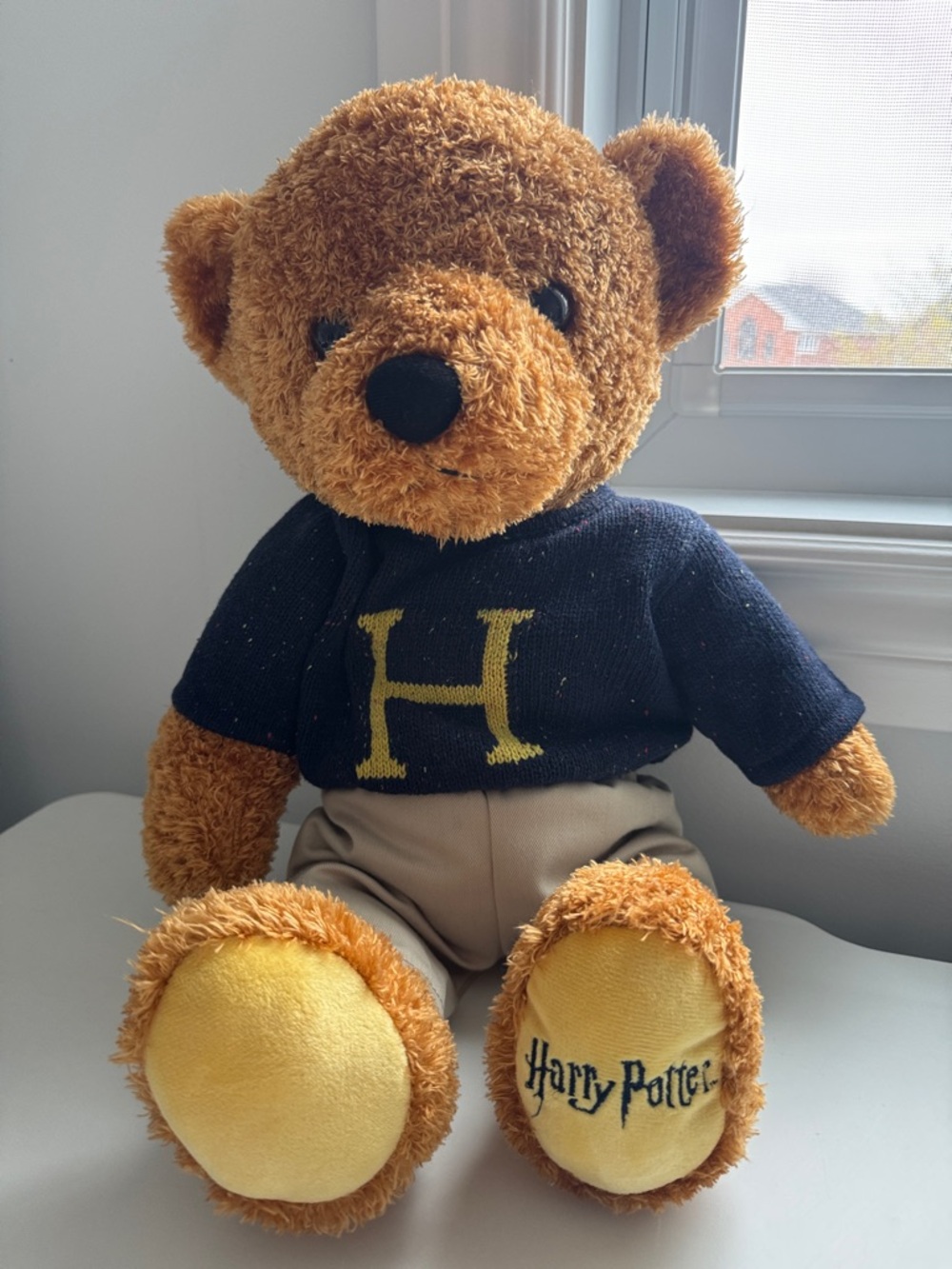 Brown Plush Teddy Bear with Navy 'H' Sweater and Yellow Accents